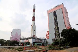 An Indian Polar Satellite Launch Vehicle carrying the Cartosat 3 Earth observation satellite rolls out to its Satish Dhawan Space Centre launch site for a Nov. 27, 2019 liftoff. 