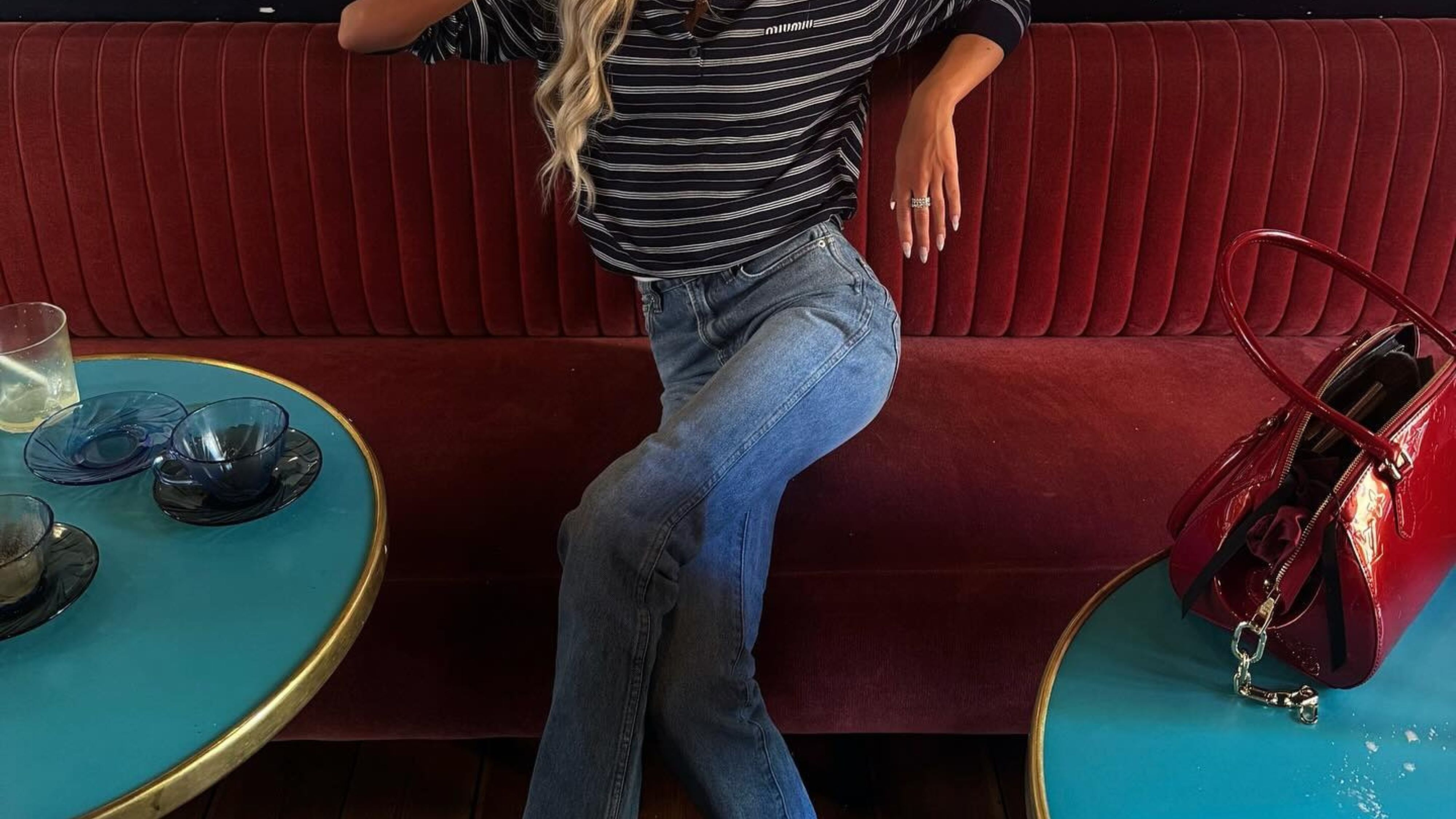 @emilisindlev showing how to style ballet flats with cigarette jeans.