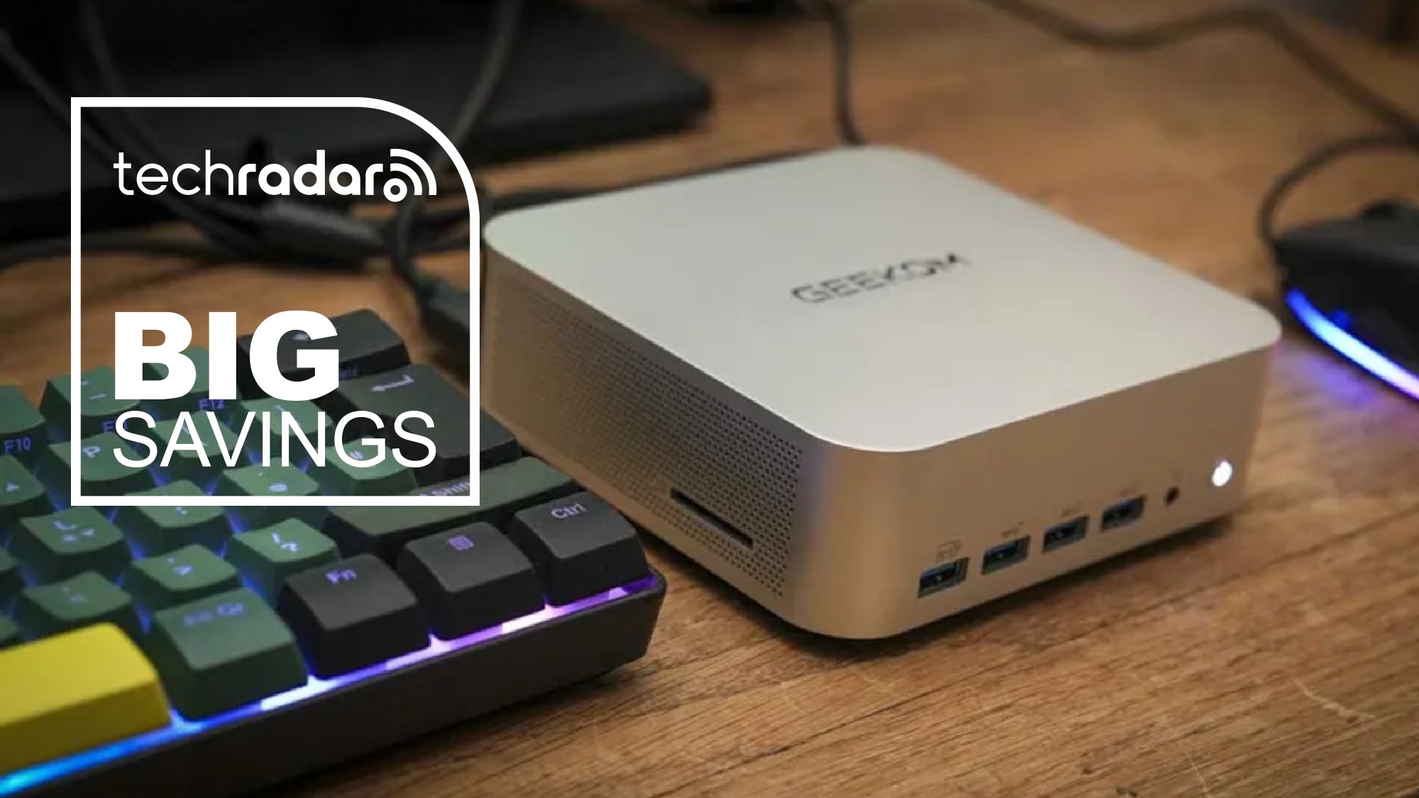 The Geekom A8 Max during our review next to a TechRadar badge that reads 'Big Savings'