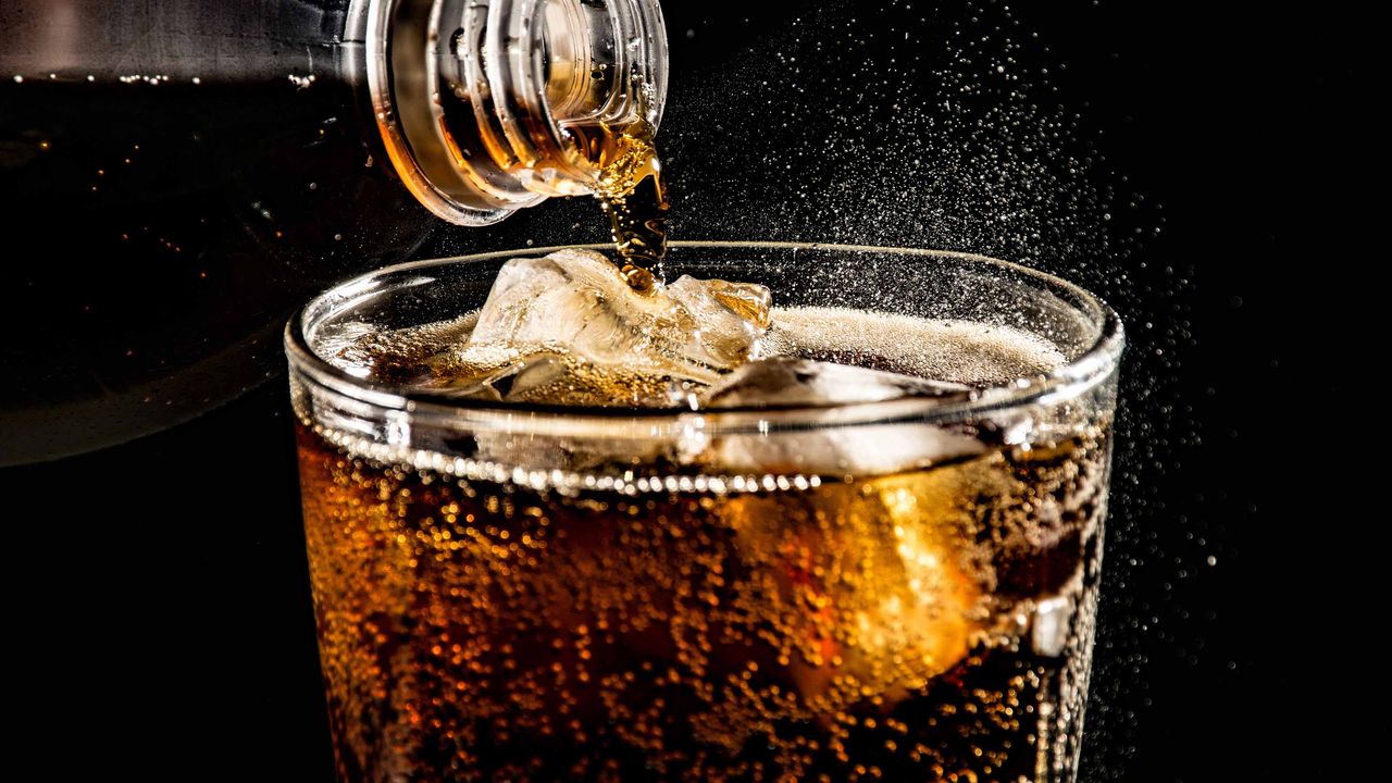 soft drink being poured into a glass