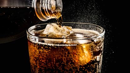 soft drink being poured into a glass