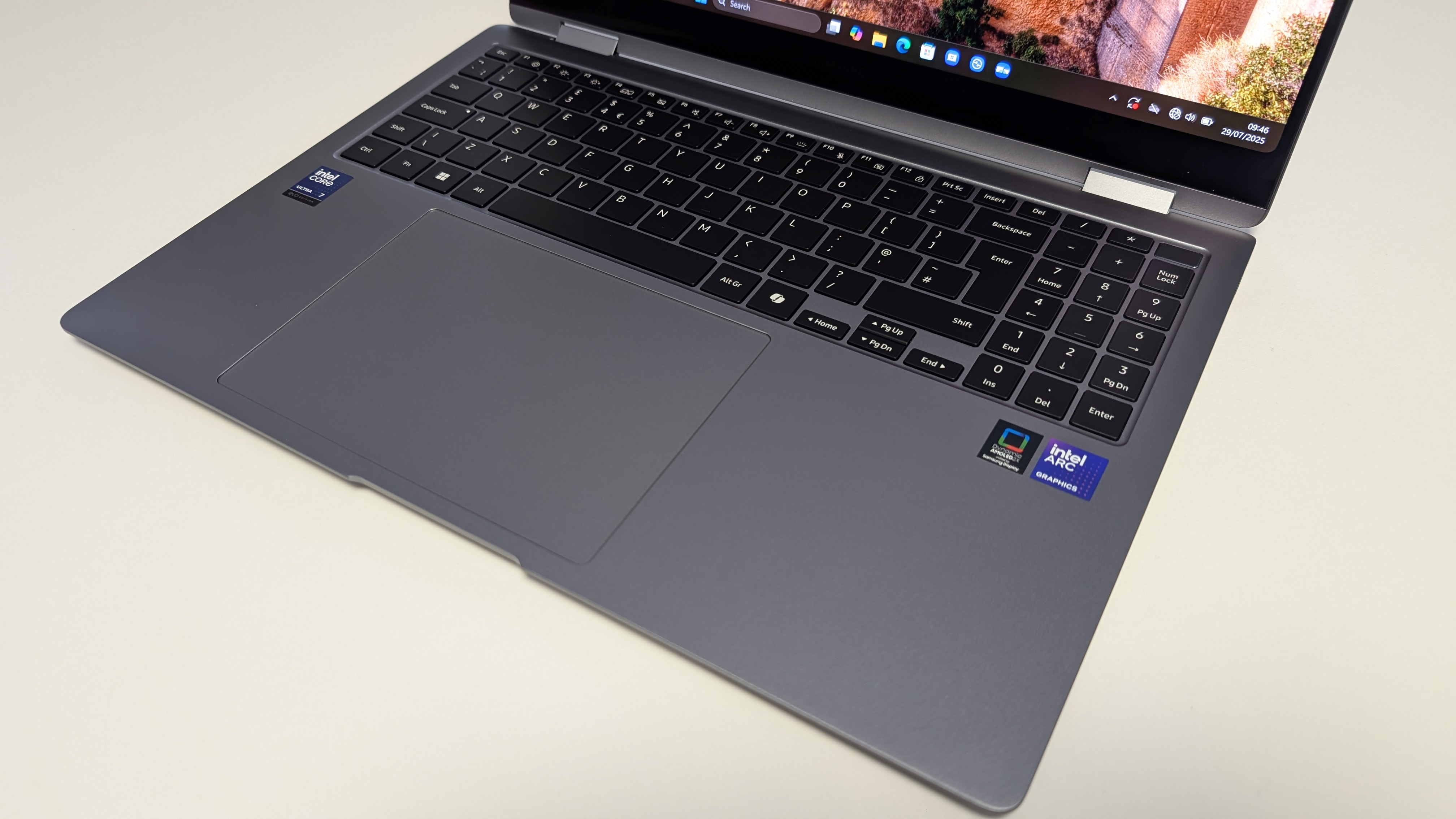 The Samsung Galaxy Book5 Pro 360 photographed on a white desk.