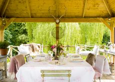 alfresco dining area with florals and linens
