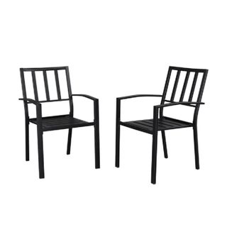 A pair of wrought iron dining chairs 