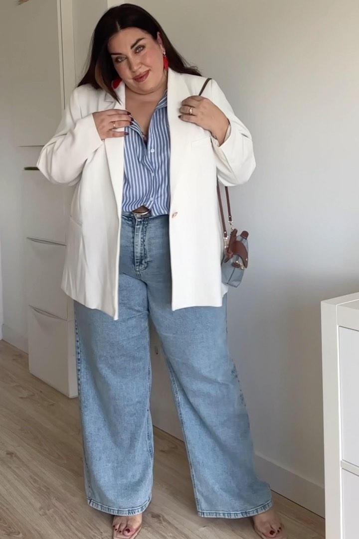 Yamila in a white blazer and light jeans