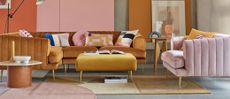Bright L sofa in yellow living room with bright cushions