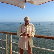 Health freelancer Ash S journaling the everyday delights she experienced when focusing her wellbeing on them for a month