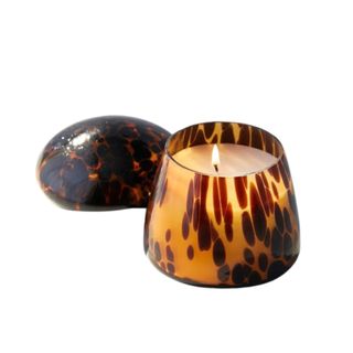 A brown mushroom candle with a lid