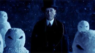 Richard E Grant's villain stands among some evil snowmen in Doctor Who's The Snowmen episode