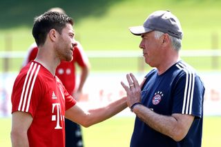 MUNICH, GERMANY - MAY 18: (EXCLUSIVE COVERAGE) Carlo Ancelotti, head coach of FC Bayern Muenchen talks to his player Xabi Alonso during a training session at Saebener Strasse training ground on May 18, 2017 in Munich, Germany. (Photo by A. Hassenstein/FC Bayern via Getty Images ) Real Madrid