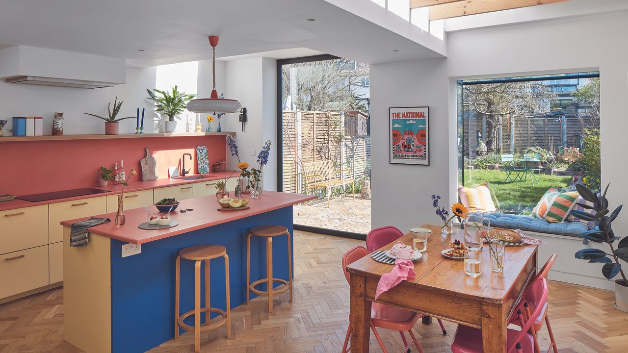 Plywood kitchen with terracotta worktops and blue island