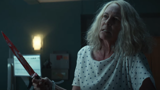 laurie strode with a bloody knife in a hospital in halloween kills