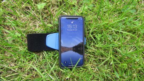 Quad Lock running armband lying in the grass