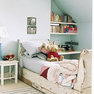 children bedroom with desk fitted shelve and teddies