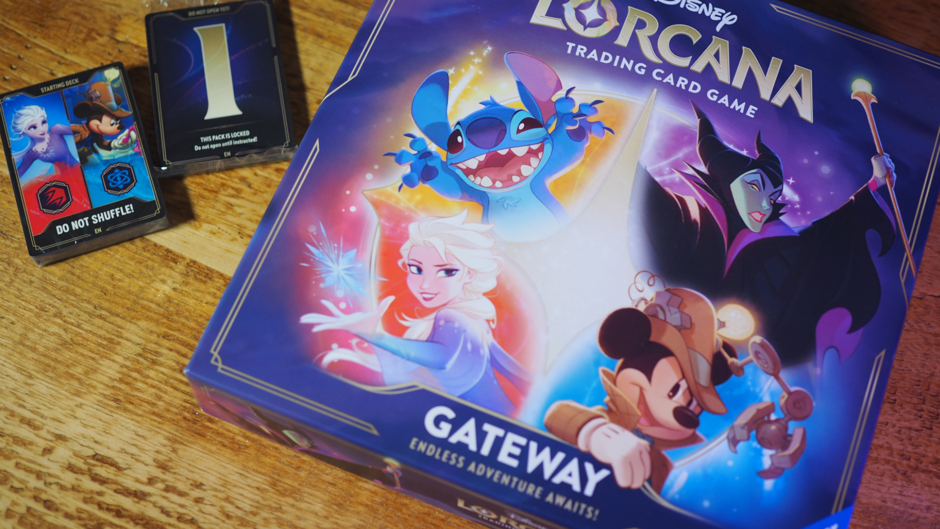 Disney Lorcana Gateway box and cards on a wooden surface