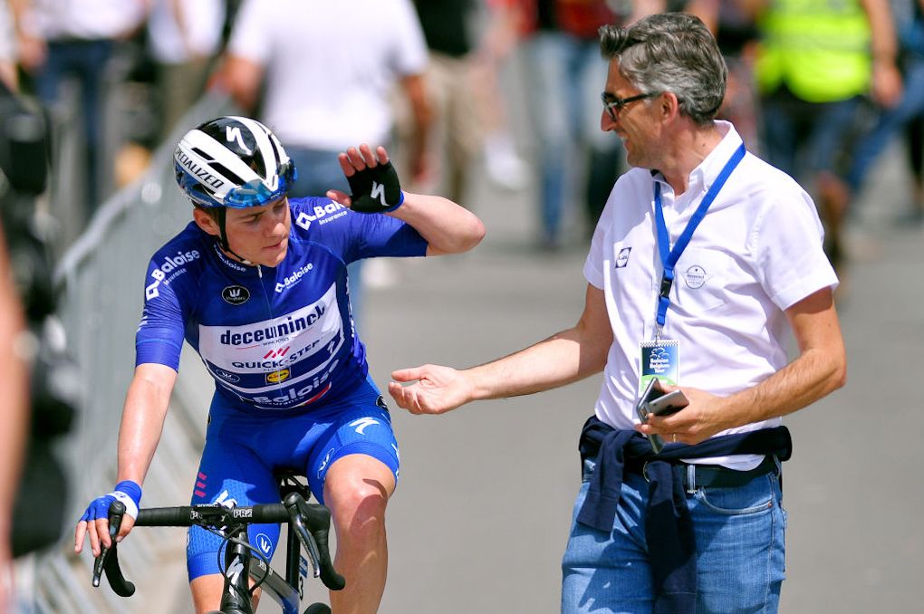 Remco Evenepoel and Deceuninck-QuickStep communications manager Alessandro Tegner celebrate the riders win at 2019 Baloise Belgium Tour