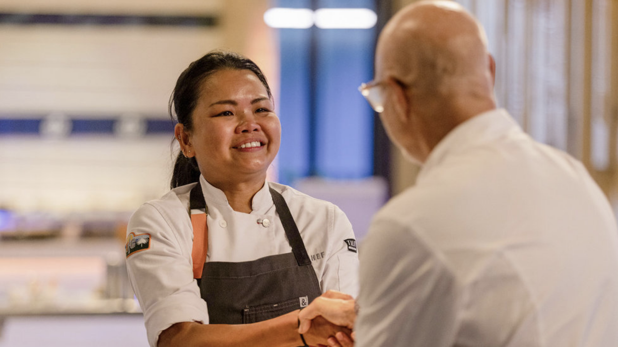 Rhoda shaking Tom's hand after winning Top Chef Season 23 Finale