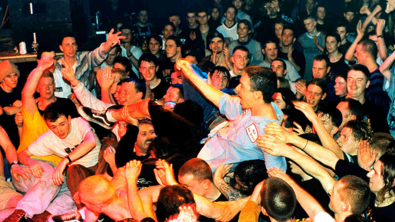 Sick Of It All&amp;rsquo;s Lou Koller crowd-surfing at a concert in the mid-90s