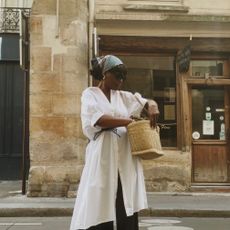 @frannfyne wearing raffia bag