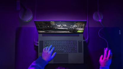 Razer Blade 17-inch laptop being used by an adult male to play computer games