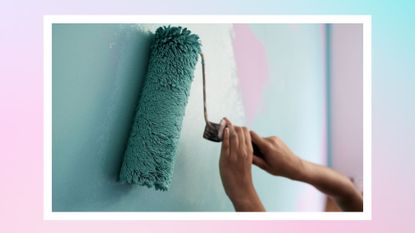 a paint roller painting a wall with blue and pink pastels