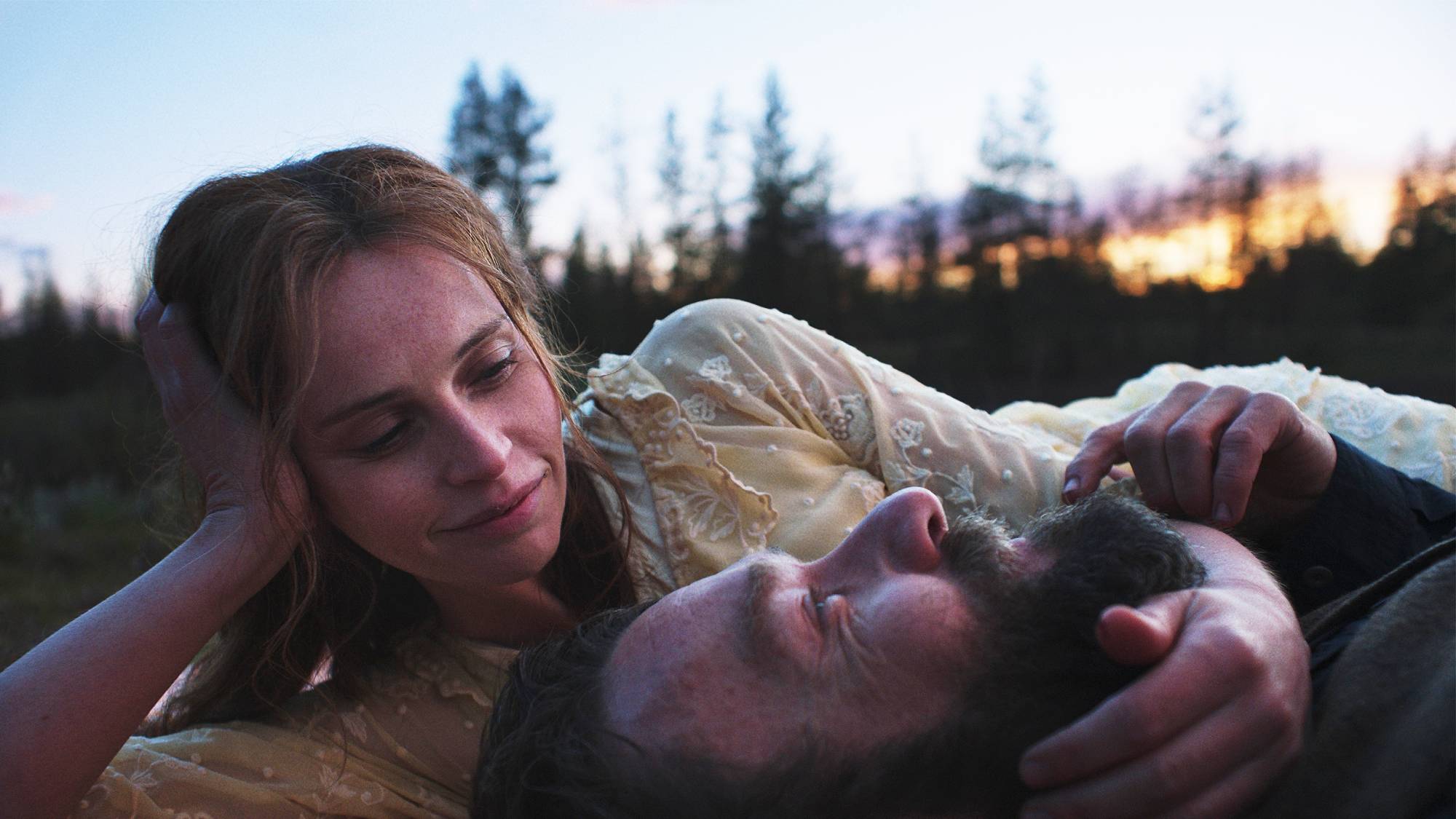 Felicity Jones as Gladys Oakley and Joel Edgerton as Robert Grainier in "Train Dreams" on Netflix