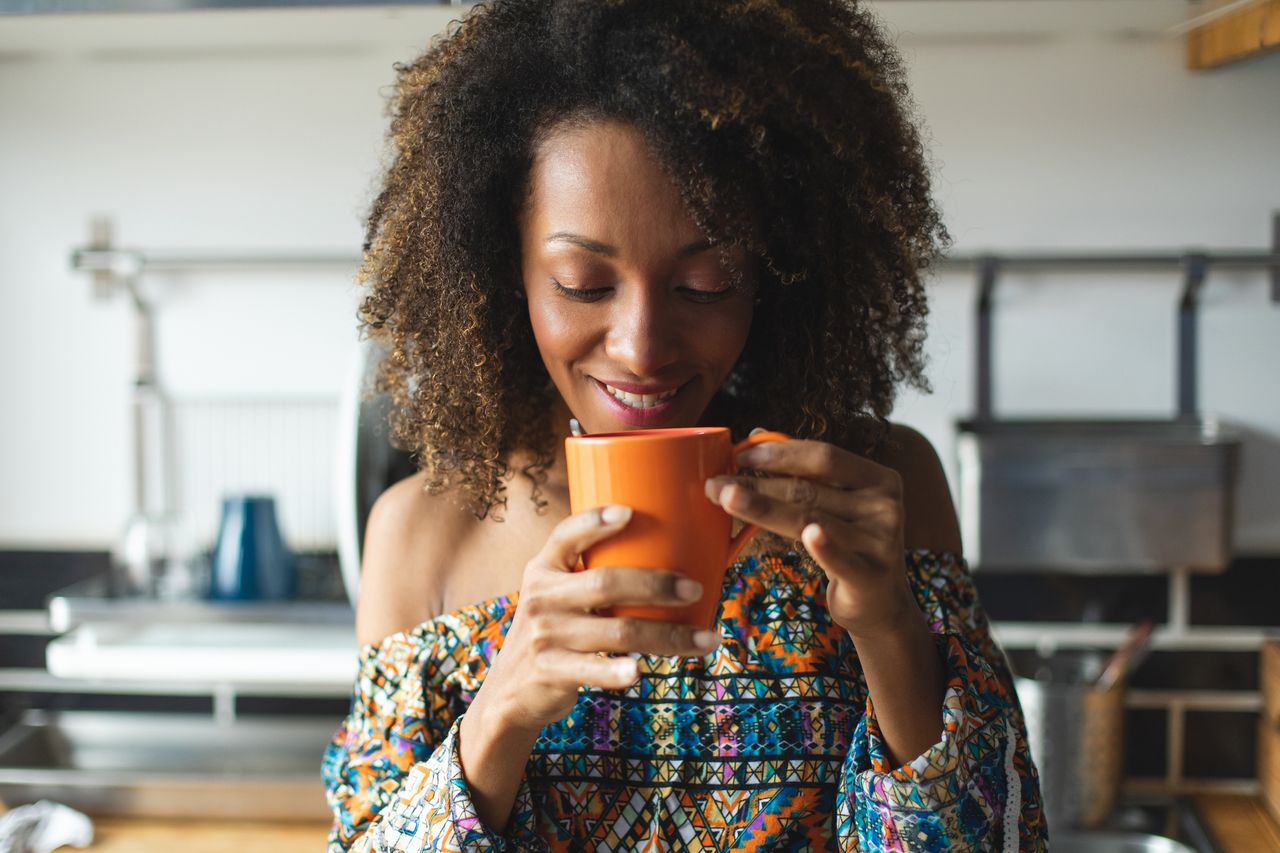 A woman drinking coffee.