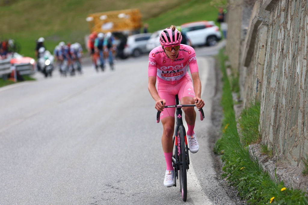 Pink jersey Team UAE's Slovenian rider Tadej Pogacar climbs during the 15th stage of the 107th Giro d'Italia cycling race, 222km between Manerba del Garda and Mottolino on May 19, 2024. (Photo by Luca Bettini / AFP)