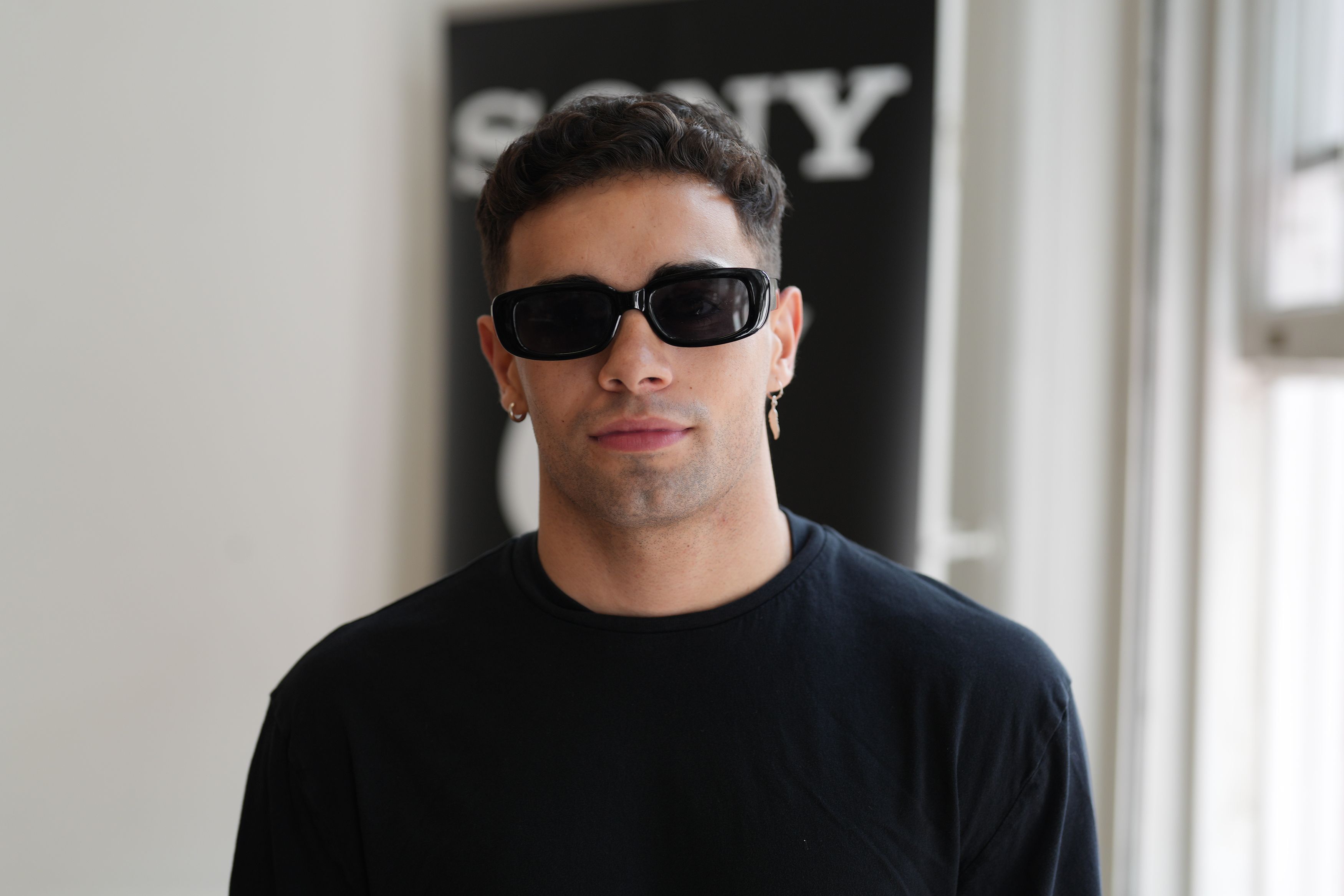 A man wearing dark sunglasses