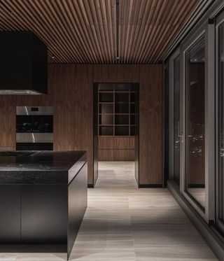 The kitchen is sleek and modern at the Vancouver House Penthouse