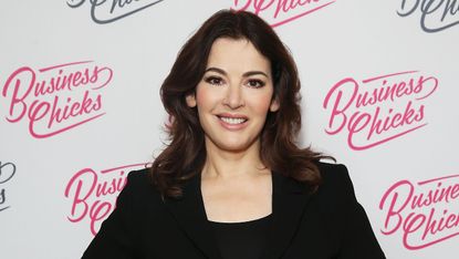 Nigella Lawson poses for the camera at a celebrity event 