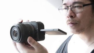 James Artaius holding a Canon EOS R50 V with 14-30mm f/4-6.4 IS STM PZ