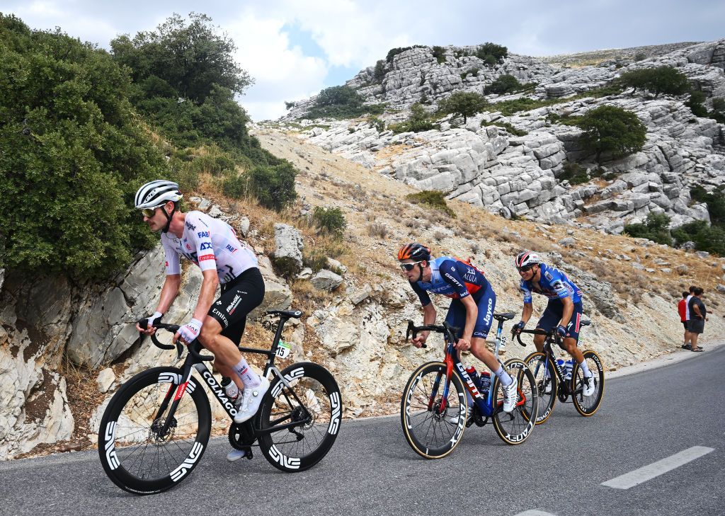 YUNQUERA SPAIN AUGUST 22 LR Jay Vine of Australia and UAE Team Emirates Chris Harper of Australia and Team Jayco AlUla and Mauri Vansevenant of Belgium and Team TRex Quick Step compete in the chase group during the La Vuelta 79th Tour of Spain 2024 Stage 6 a 1855km stage from Jerez de la Frontera to Yunquera UCIWT on August 22 2024 in Yunquera Spain Photo by Dario BelingheriGetty Images