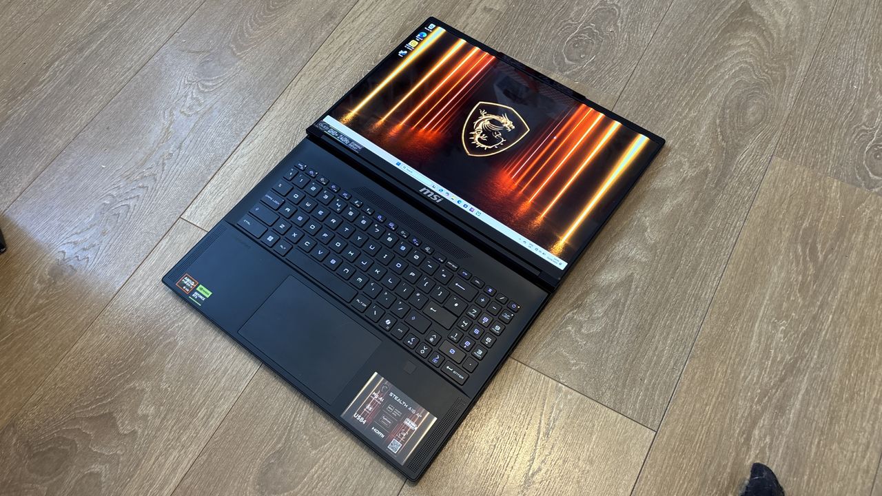 MSI Stealth A16 AI+ on wooden surface