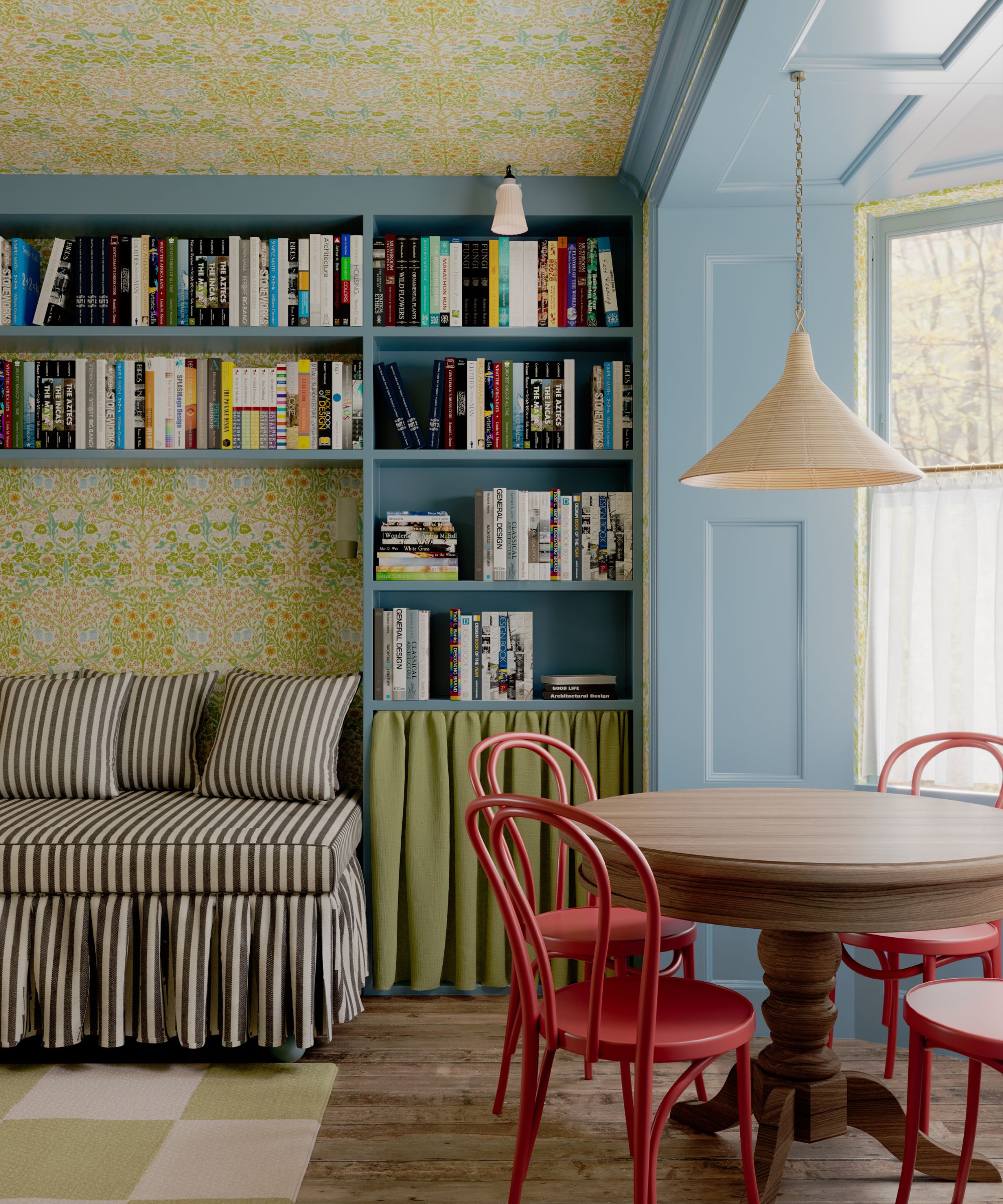 Living room with blue painted built-in bookcase, green floral wallpaper, wooden breakfast table with red bistro chairs, banquette stripy seat and low pendant light