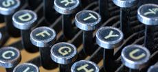 old fashioned typewriter keyboard with QWERTY layout