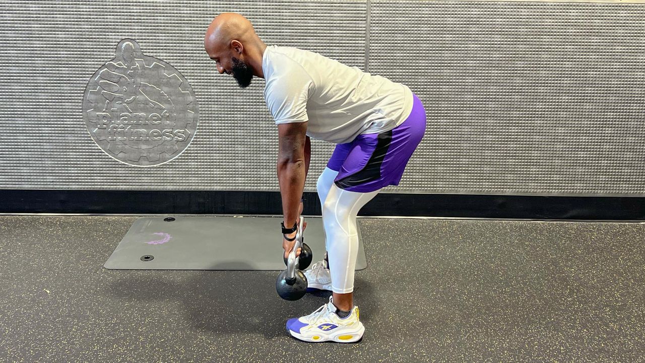 Teddy Savage performing a Romanian deadlift to upright row