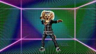 The Masked Dancer character Pearly King - a furry lion dressed up in a suit covered in pearls