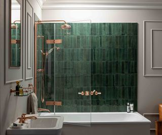 copper shower over bath and green bathroom wall tlies