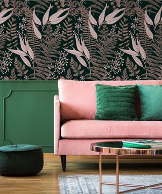Biophilic living room with fern wallpaper, pink velvet sofa and green cushions and wall section