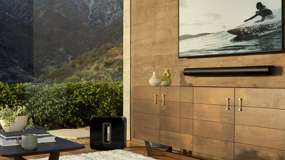 The Sonos Arc soundbar attached to a wall underneath a TV