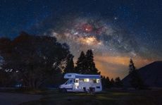 An RV under a starry sky
