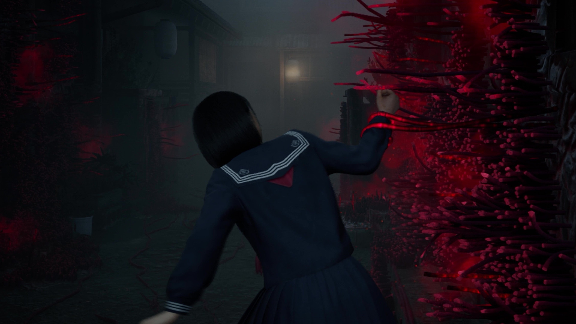 Hinako is grabbed by encroaching red growths on a wall in Ebisugaoka in Silent Hill f as she tries to escape the fog