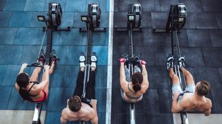 an image of people on rowing machines at the gym 