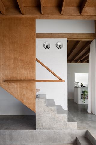 wood stair rail with concrete steps