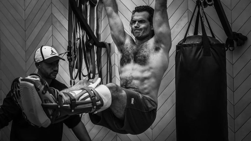 Henry Cavill doing shirtless pullups with a busted up leg