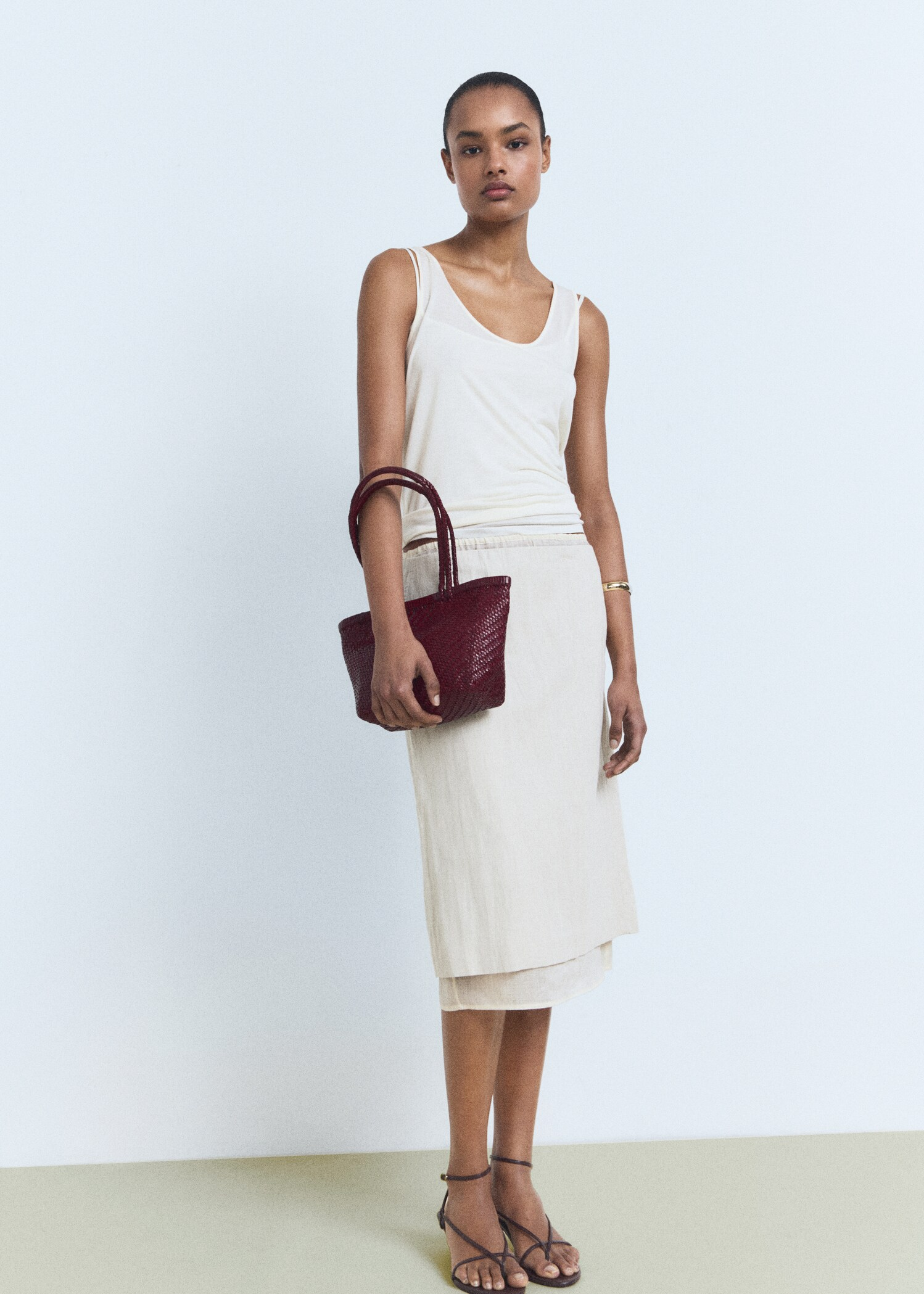 An image of a burgundy bag from Mango.