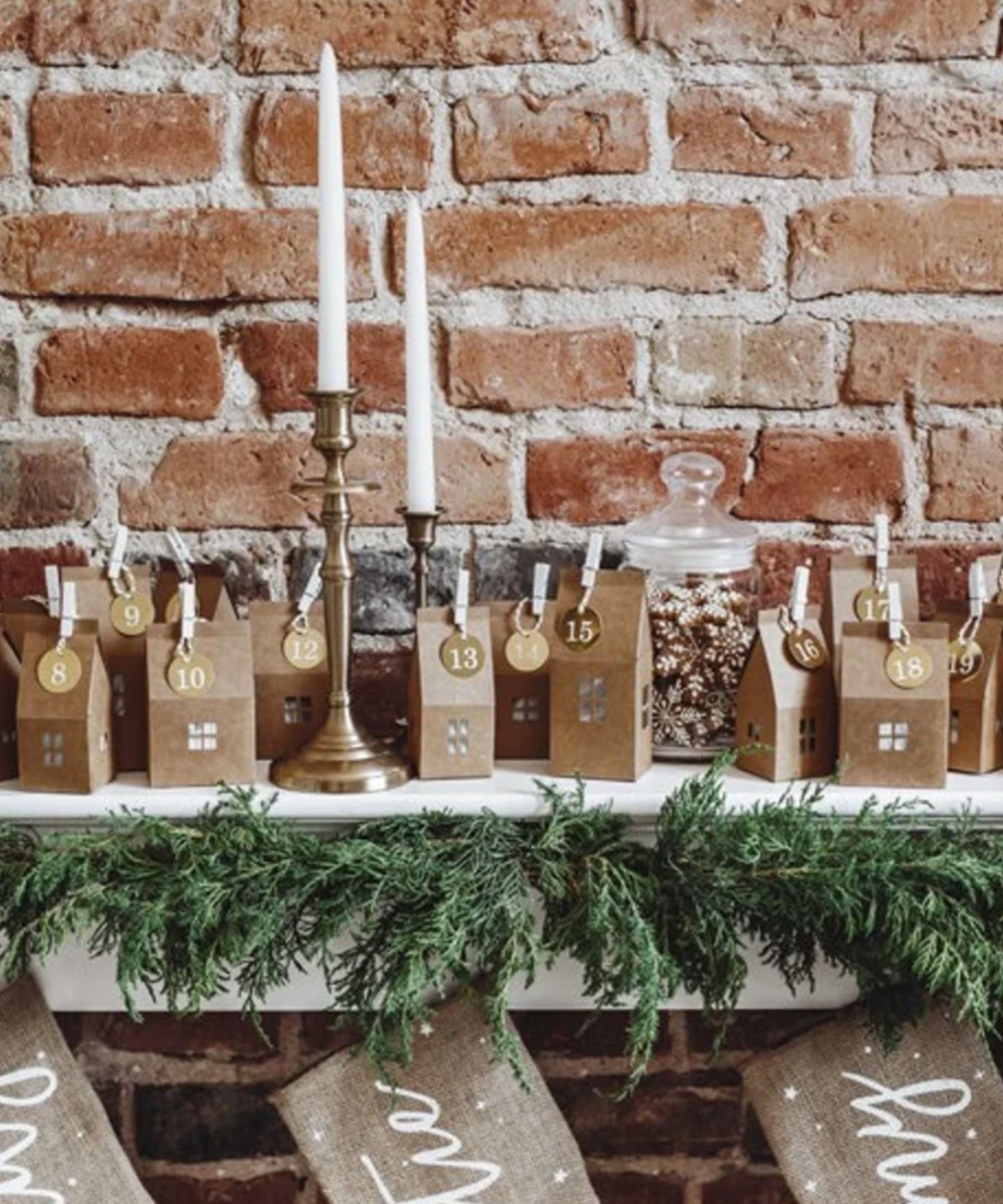 Brown card advent houses on a mantel