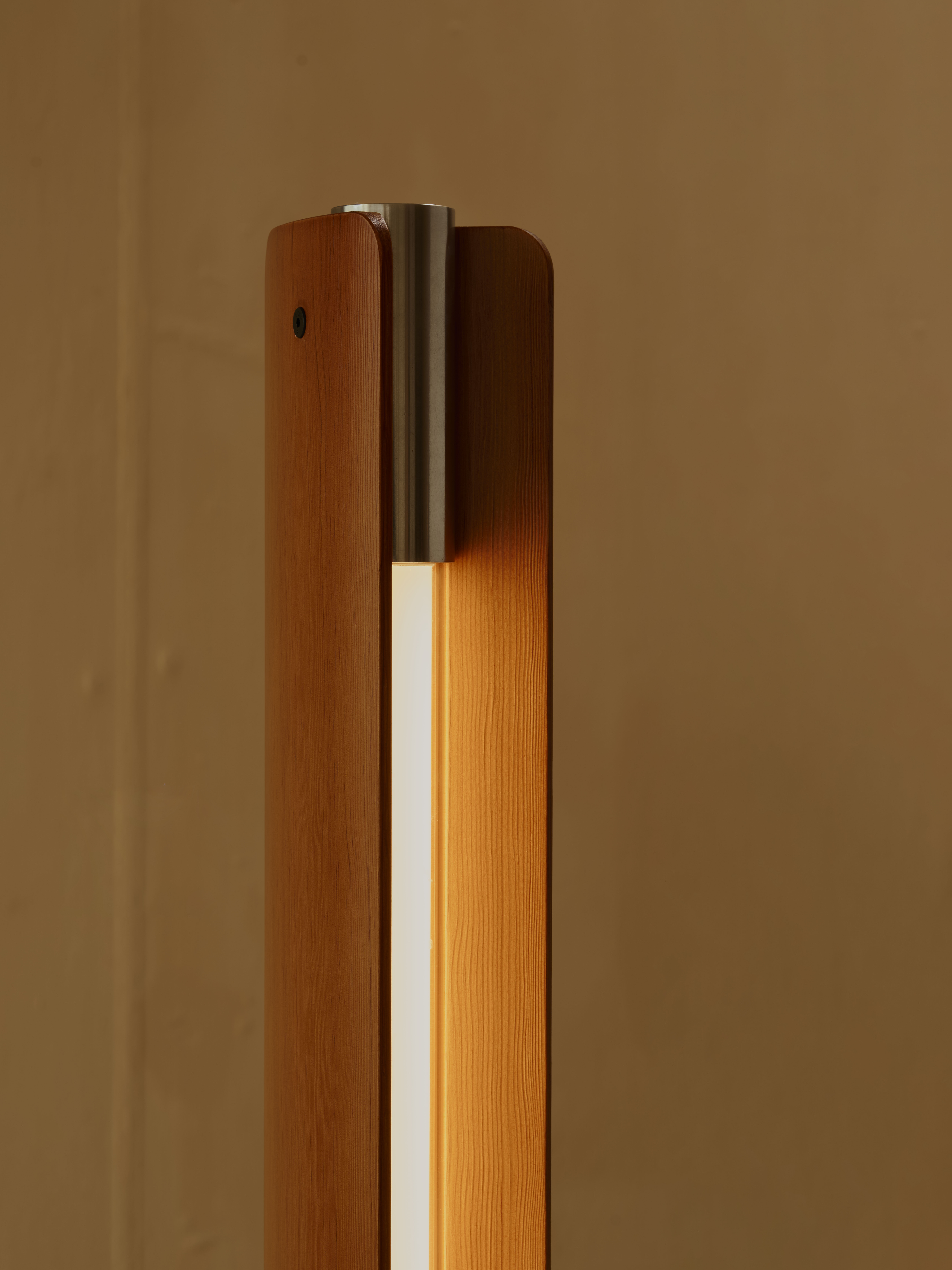 Tobia Scarpa light for Flos made of two wooden slats on each side of the light source