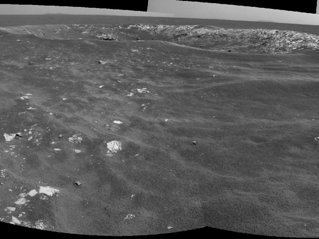 NASA&#039;s Mars Exploration Rover Opportunity recorded this view of a crater informally named &quot;Freedom 7.&quot; The image combines two frames that Opportunity took with its navigation camera on May 2, 2011.